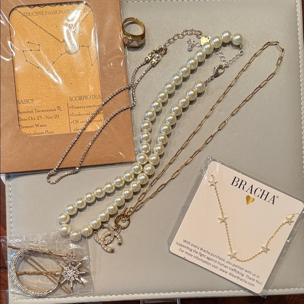 lot of necklaces and rhinestone hairclips and ring
